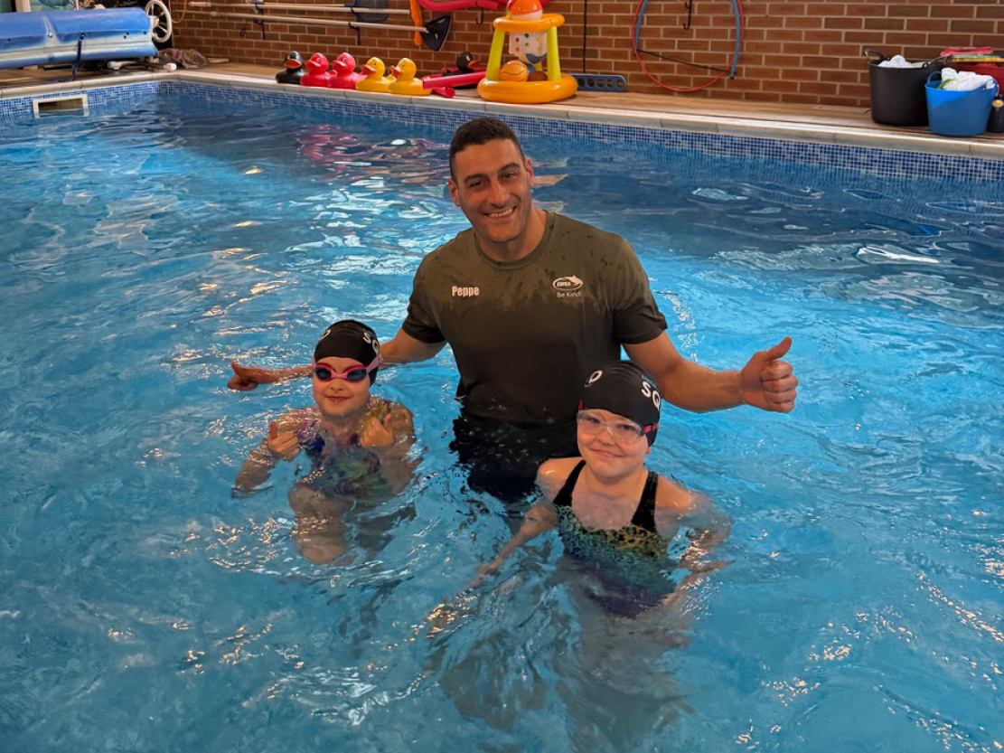 Two of our swimmers saying goodbye to Peppe